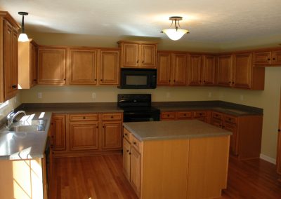 Kitchen showing wooden cabinets and new appliances