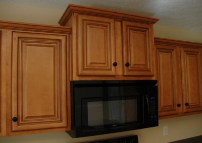 Wooden cabinets and wall-mounted microwave